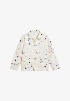 Veste en coton avec une base crème et des motifs éclaboussés multicolores en rouge, jaune, bleu et rose. Dotée d'un col et de deux poches avant.