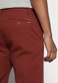 Levi's® Chinos - fired brick