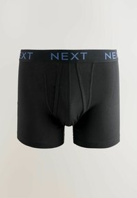 Boxer negro hecho de tela elástica con un logotipo azul de NEXT en la banda elástica de la cintura y un diseño ajustado con un frente contorneado.