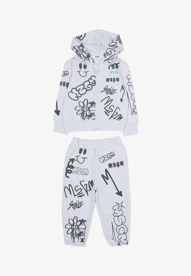 Lichtgrijze kinderhoodie en broekset met zwarte graffiti-achtige tekeningen, glimlachende gezichten, bloemen, pijlen en 'MSGM'-tekst.
