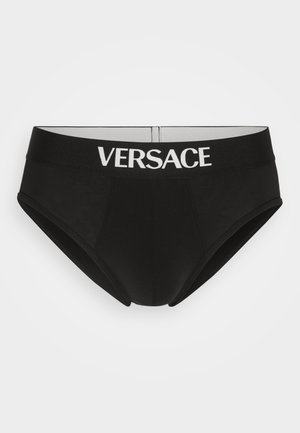 Sous-vêtements noirs avec une finition lisse, dotés d'une large ceinture élastique blanche ornée de la marque "VERSACE" et d'une coupe classique de slip.