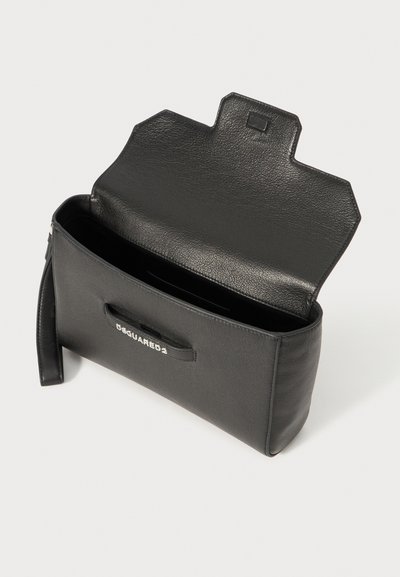 Black leather handbag with a textured surface, open top, and short handle. Features a visible brand logo on the front. Interior is spacious.