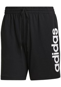 Shorts deportivos negros hechos de una tela suave, con una cintura elástica con cordón y un gran logo blanco de "adidas" en un lateral.