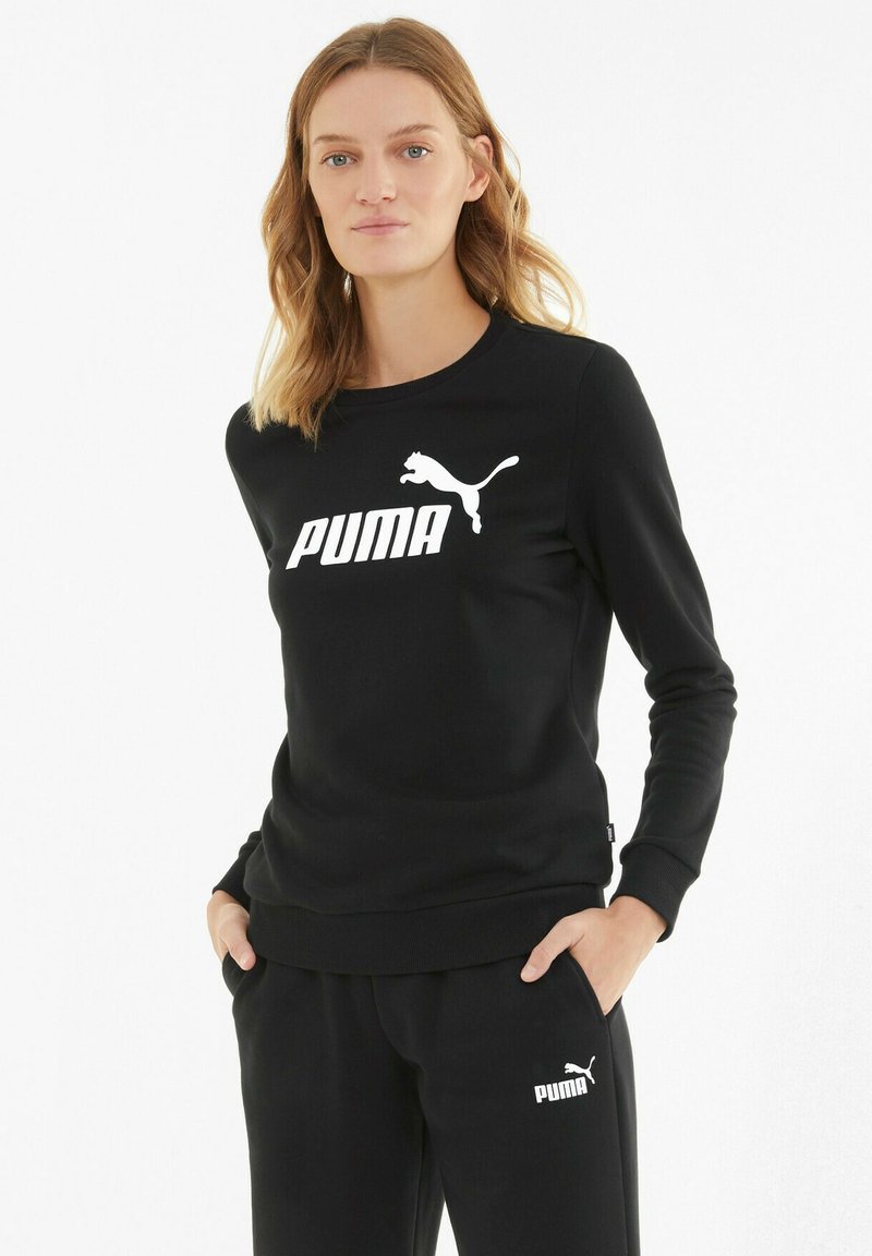Black sweatshirt made of soft fabric, featuring a white Puma logo and silhouette on the front. Long sleeves and crew neck design.