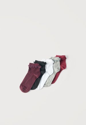 Five ankle socks in burgundy, black, white, gray, and red colors, each with a ruffled cuff, arranged side by side on a light background.
