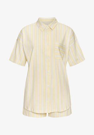 Košile s krátkým rukávem, límečkem a knoflíky v žlutých a bílých pruhách s náprsní kapsou; vyrobená z jemné tkaniny s volným střihem.