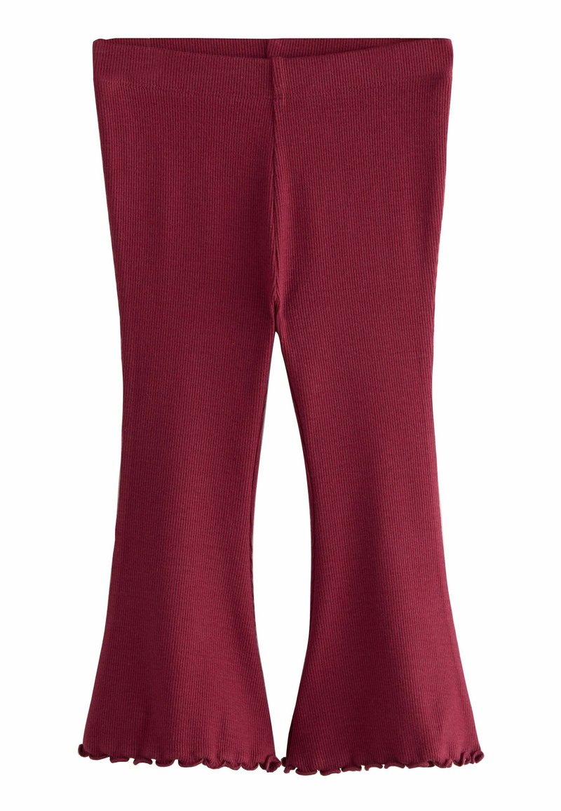 Leggings en maroon côtelé avec un bas évasé, présentant un ourlet ondulé et une taille ajustée. Texture douce et coupe ajustée tout au long.