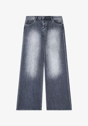 Jeans de tiro ancho en un lavado gris oscuro deslavado. Con cinco bolsillos, cierre de botón y detalles de dobladillo sin rematar. Tela suave de peso medio.