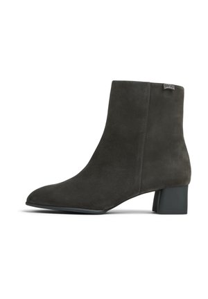 Dark gray suede ankle boot with a block heel and pointed toe, featuring a small branded tag near the top edge on the side.