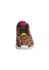 Leopard print sneaker with pink accents, black laces, and white sole. Features Adidas logo on tongue and "TORSION" label on side.