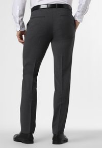 Tailored dark gray dress pants featuring a slim fit, flat front, smooth texture, and two back pockets. Completed with black dress shoes.