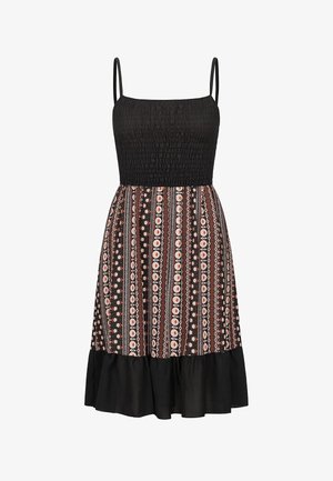 Sort spaghetti-stropkjole med smocket korset, med et mønstret skørt i brune, hvide og ferskenfarvede nuancer samt en udvidet sort kant.