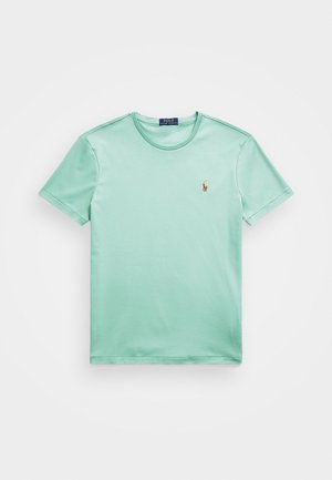 Mint grøn kortærmet t-shirt lavet af bomuld. Har en rund halsudskæring og et lille broderet logo på venstre bryst. Glat tekstur.