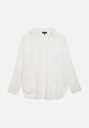 Camisa blanca de manga larga con cuello, un bolsillo en el pecho y un ajuste holgado. Fabricada con una tela ligera y ligeramente texturizada.