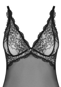 Czarny koronkowy biustonosz typu bralette z kwiatowymi wzorami, przezroczystymi miseczkami z siateczki oraz regulowanymi ramiączkami; posiada mały ozdobny guzik z przodu na środku.