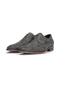 Chaussures habillées à lacets en tissu texturé bleu et marron, dotées d'un bout pointu et d'un talon en bois avec une subtile touche de couleur.