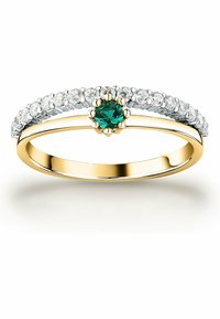 Gold- und Silberring mit einem zentralen grünen Stein, umgeben von klaren Steinen, geschwungenem Design, polierter Oberfläche und zarter Band.