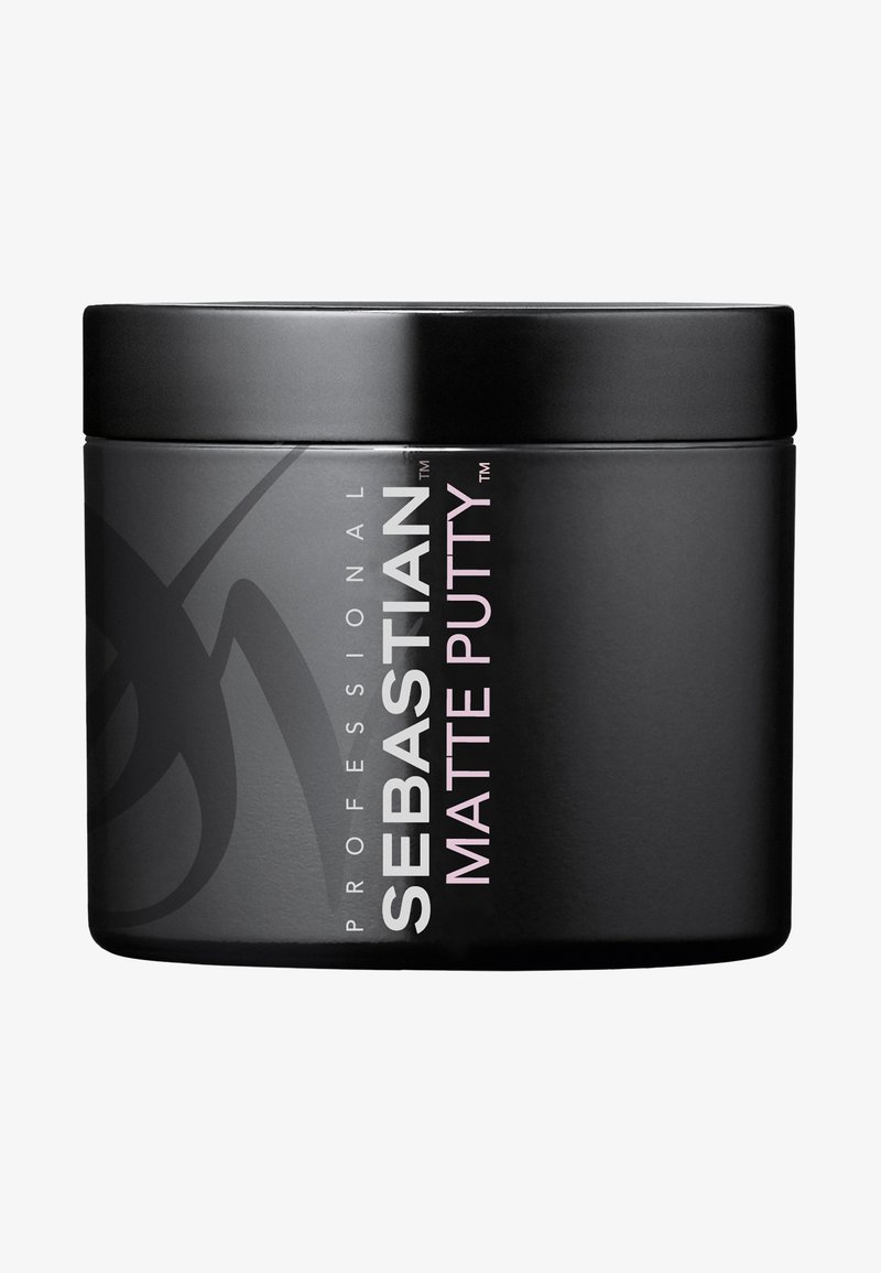 Schwarzer Behälter von Sebastian Matte Putty, mit matter Oberfläche, runder Form und auffälligem weißen und rosa Text auf der Seite.