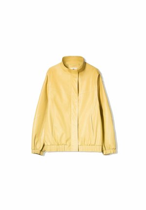 Jacka i konstläder - mottled light yellow