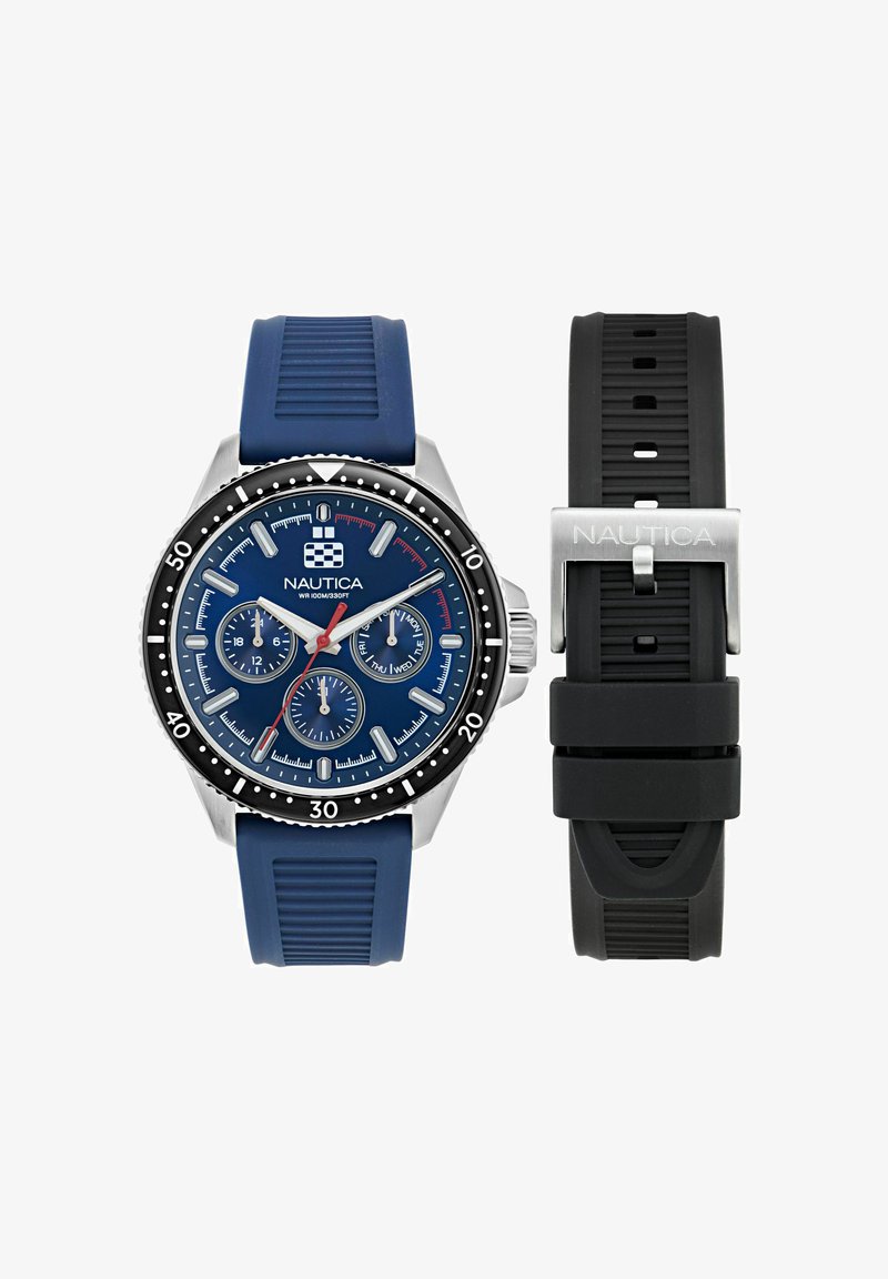 Nautica kellad sinise kummirihmaga, hõbedast roostevabast terasest korpus ja tumesinine nelk, millel on kolm alamnäidikut, valged aktsendid ja must bezel.