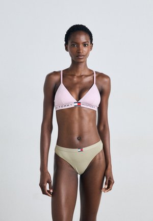 Light pink cotton bralette with adjustable straps and logo band, paired with olive green cotton bikini briefs featuring a logo tag.