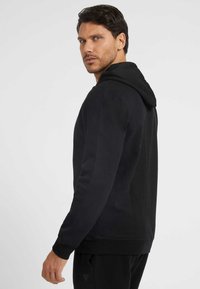 Guess Felpa con zip - schwarz