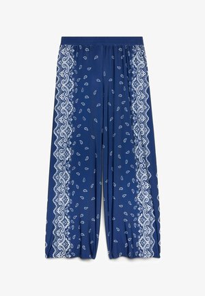 Modré kalhoty s širokými nohavicemi s bílými paisley a krajkovými vzory na okrajích, elastickým pasem a volným střihem.