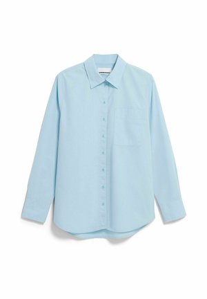 Chemise bleu clair à boutons, col pointu, manches longues et poche poitrine. Confectionnée dans un tissu tissé lisse. Ourlet arrondi en bas.