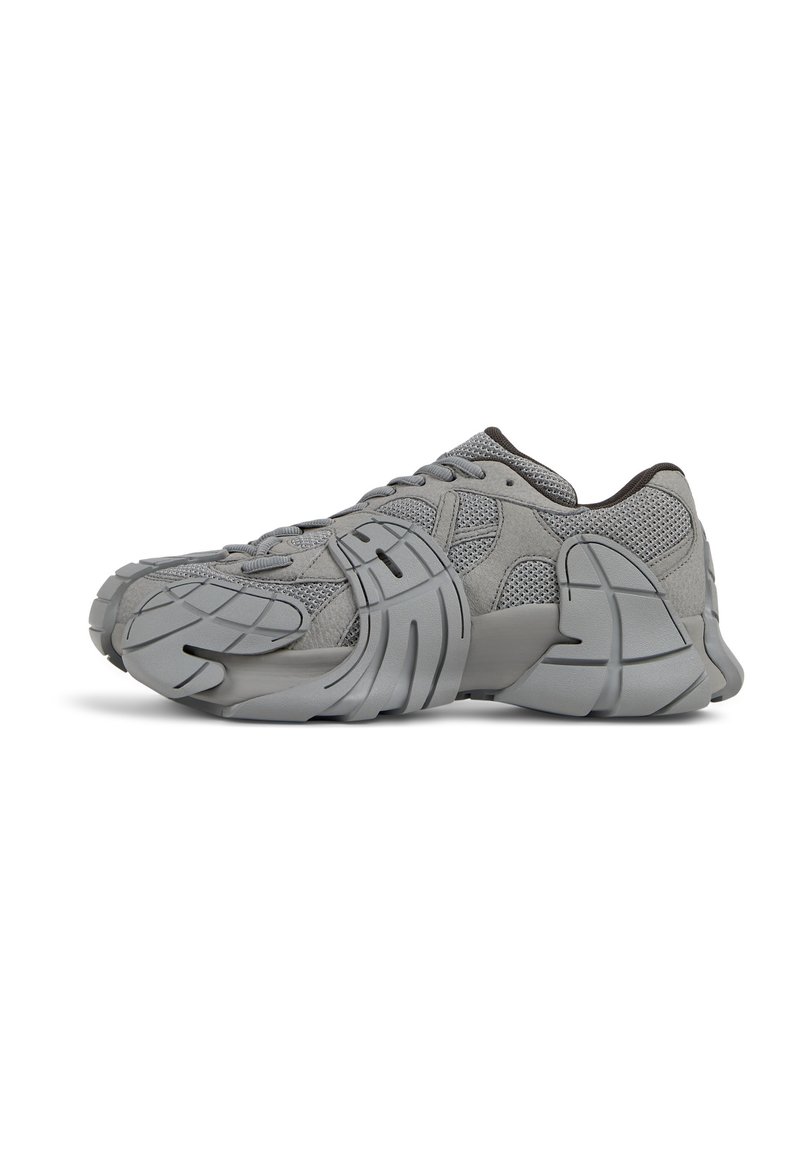 Gray athletic shoes with a mesh and suede upper, featuring a sculpted rubber sole, textured accents, and a lace-up design.