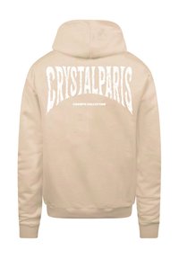 Felpa beige realizzata in morbido tessuto, con cappuccio e grande testo bianco sul retro che recita "CRYSTALPARIS CHAMPS COLLECTION."