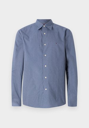 Lange mouw blauwe knoopsluiting shirt met kleine witte stippen, een button-down kraag en een logo op de borst. Soepele stof met een lichte textuur.