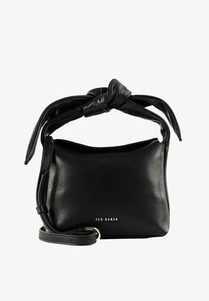 Sac à main Ted Baker en cuir noir avec une poignée supérieure nouée et une bandoulière ajustable, petite forme rectangulaire, texture lisse.