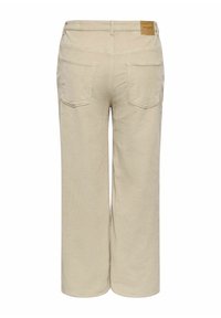 Bež manšetne hlače širokih nogavica, s dva stražnja džepa i pravokutnom smeđom oznakom iznad desnog džepa.