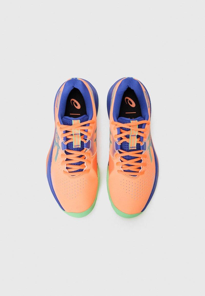 Sneakers with orange synthetic upper, blue accents, and green sole. Features lacing system and perforated detailing for breathability.