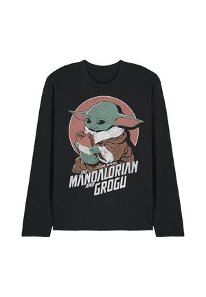 Black long-sleeve shirt with Grogu from Star Wars holding a frog, text reads "The Mandalorian and Grogu" below the character.
