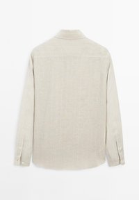 Beige long-sleeve button-up shirt with subtle vertical white stripes, folded cuffs, and a classic back yoke on a white background.