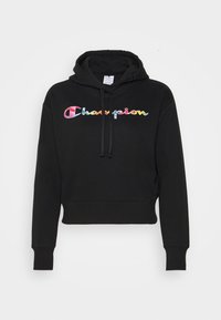 Svart croppad hoodie i mjukt material, med en flerfärgad "Champion"-logotyp över bröstet och dragsko i huvan.