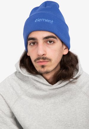 Blue ribbed knit beanie with "element" logo, paired with a gray hoodie featuring a textured fabric and a large hood.