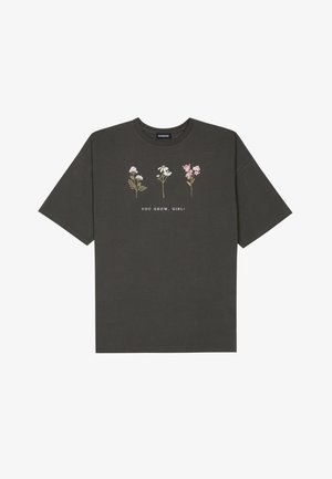 Gray cotton T-shirt with short sleeves and a round neckline. Features floral prints and the text "YOU GROW, GIRL!" in white.