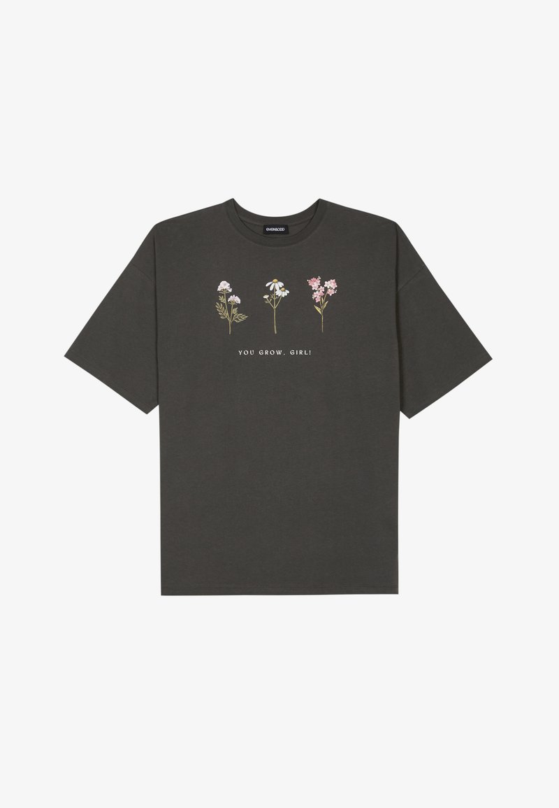 Graues Baumwoll-T-Shirt mit kurzenÄrmeln und Rundhalsausschnitt. Mit floralem Druck und dem Text "DU WÄCHST, MÄDCHEN!" in Weiß.