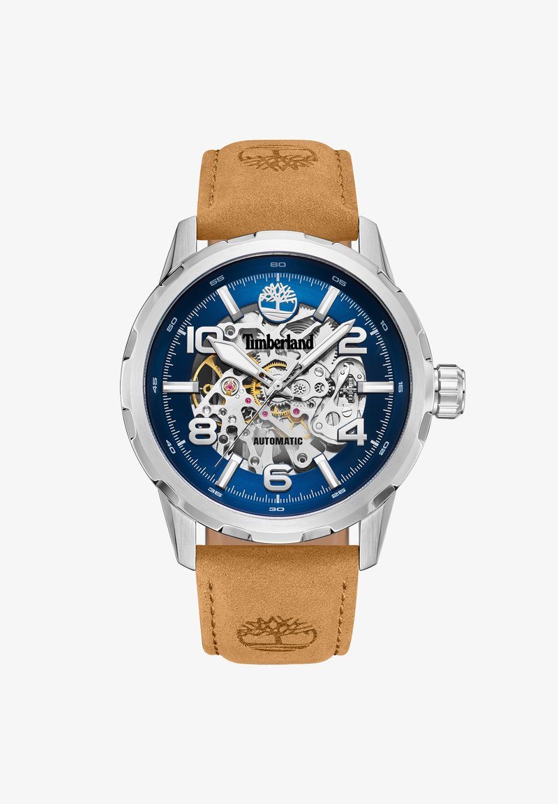 Automatyczny zegarek Timberland z niebieską tarczą, srebrną kopertą i brązowym skórzanym paskiem. Posiada odsłoniętą mechanikę i wyraźne znaczniki godzin.