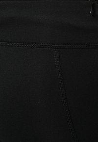 Svarta leggings i stretchigt tyg, med en mjuk yta, platta sömmar och en hög midje-design.