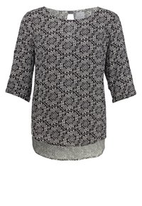 Blouse à manches trois-quarts à motif noir et blanc, avec un décolleté en forme de goutte et un détail d'ourlet transparent à motif.