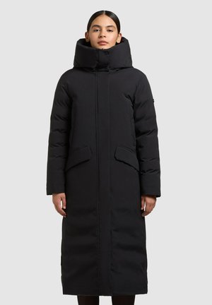 Must pikk topp-koos kõrge kraega, millel on kaks eesmist taskut ja sirge siluett. Valmistatud siledast, isoleeritud kangast.