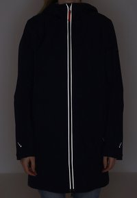 Black coat with a hood and reflective zipper. Features subtle star patterns on cuffs, long sleeves, and a straight cut.