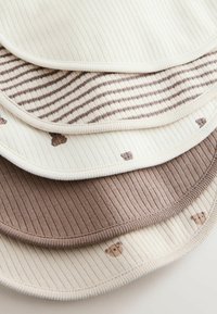 Set of four soft, ribbed cotton bibs featuring a mix of solid and striped patterns in beige and brown, with small bear motifs on two bibs.