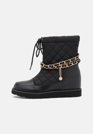 Botines de cuña - black