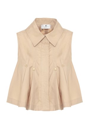Blusa beige senza maniche con ampio colletto a punta, cuciture verticali e patte decorative con bottoni dorati sul davanti.