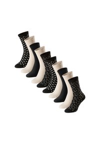 Ni par mid-calvessokker i skiftende solid sort, beige og sort med hvide hjerte- og cirkeldesign arrangeret i en diagonal linje.