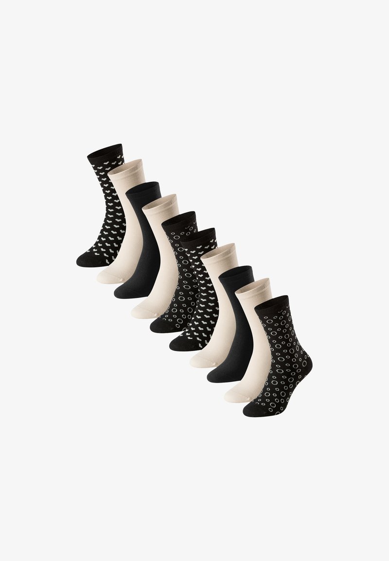Neun Paare von Socken bis zur Mitte des Wadenbereichs in abwechselnd einfarbig Schwarz, Beige und Schwarz mit weißen Herz- und Kreis-Mustern, die in einer diagonalen Linie angeordnet sind.